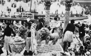 The Zulu King debarks on the morning of Mardi Gras in his tug boat at the head of the New Basin canal in New Orleans. 1936.